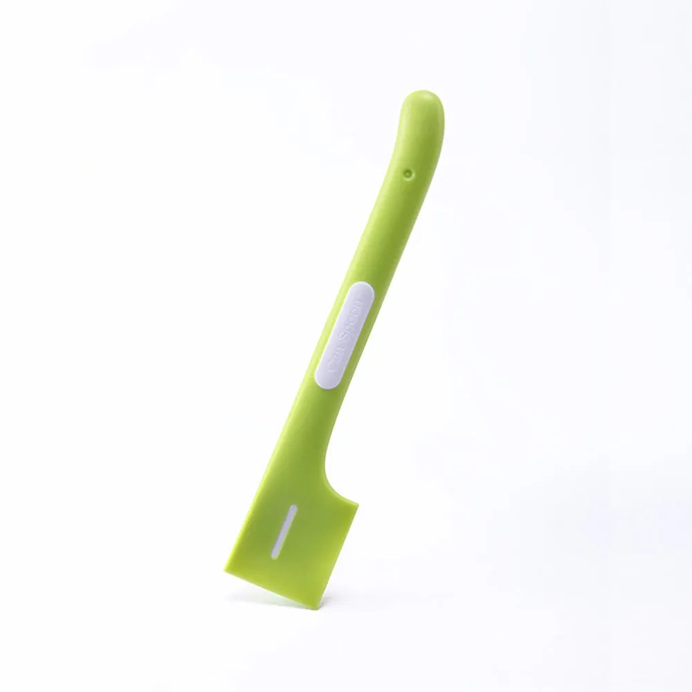 Green long-handled pet feeding spoon for scraping canned cat or dog food