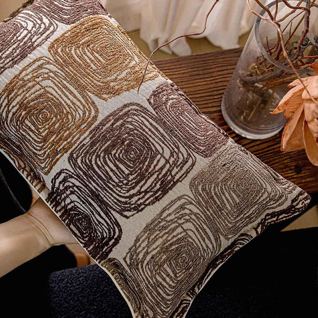 Cream and coffee-coloured abstract coil pattern pillow cover showing square and rectangular sizes
