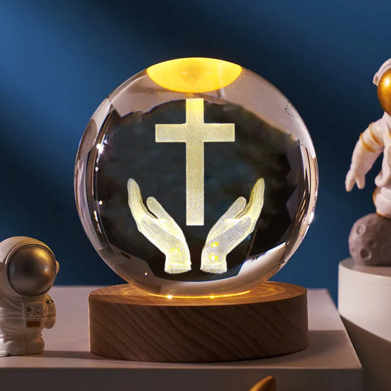 White crystal cross ornament with 6cm ball on wooden warm light base