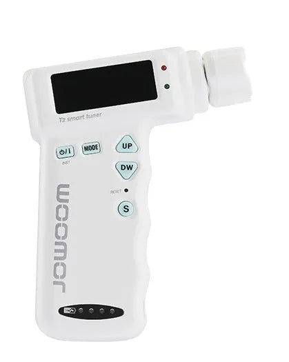 Black and white smart guitar tuner and string winder combo with LCD display and USB charging cable