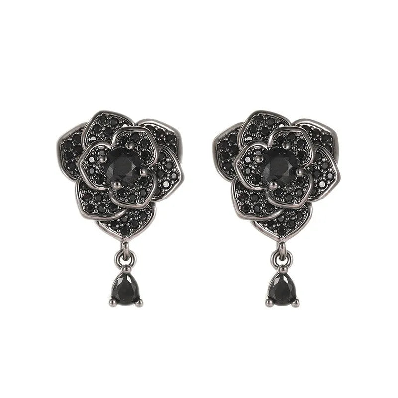Pair of black rose zircon floral stud earrings with an 18K gold electroplated finish on copper.