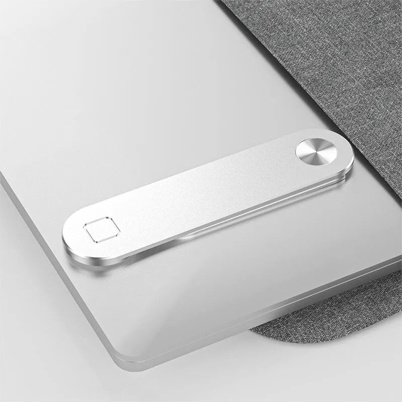 Black aluminium laptop phone holder with magnetic mount attached to computer monitor side