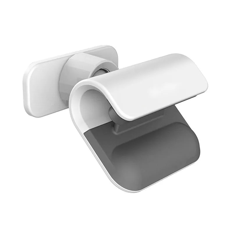 Black gravity car phone holder with 360-degree rotating head mounted on a car dashboard