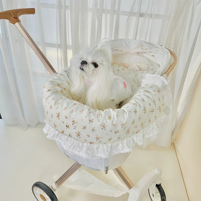 Pet stroller three-piece set showing removable towel, cushion and pillow in floral pattern