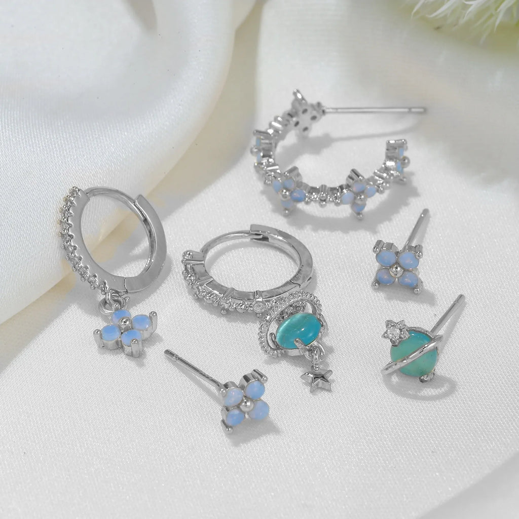 Gold and silver floral stud earrings with blue protein stone mosaic design.