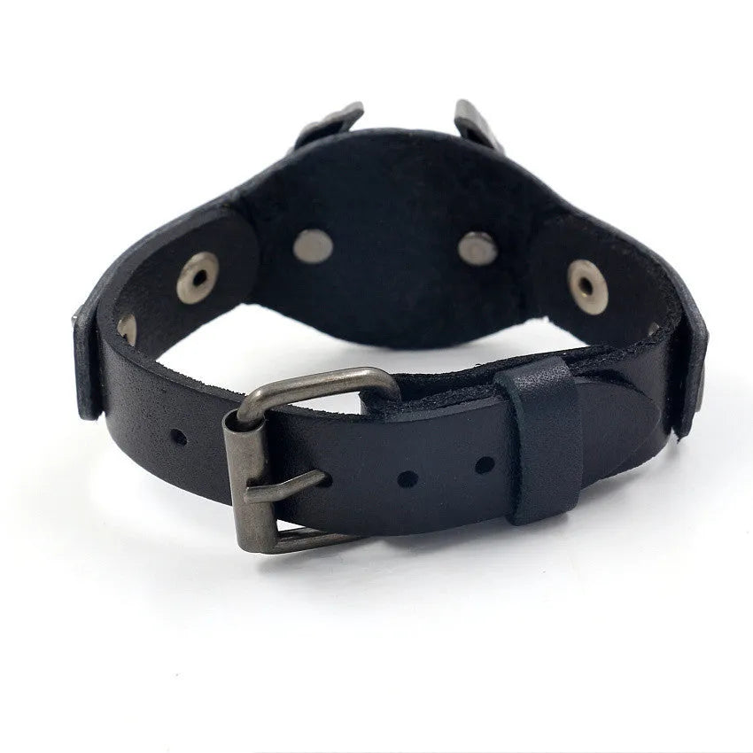 Black geometric eagle head leather bracelet with tapered width and button fastening.