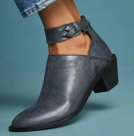Vintage high heels woman ankle boots with round toe and middle heel in black artificial PU