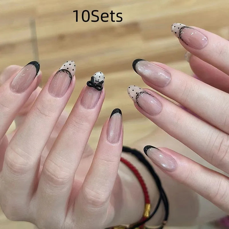 Set of colourful artificial false nails with glitter designs for DIY manicures.