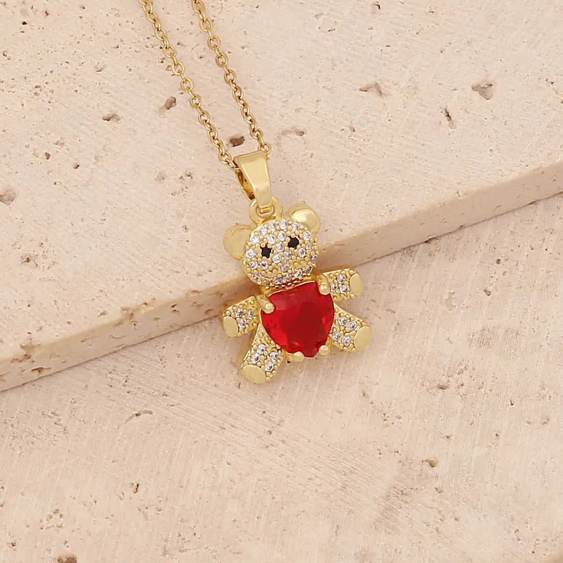Copper micro inlaid zircon bear love gem necklace in green on a white background, adjustable 41-50cm