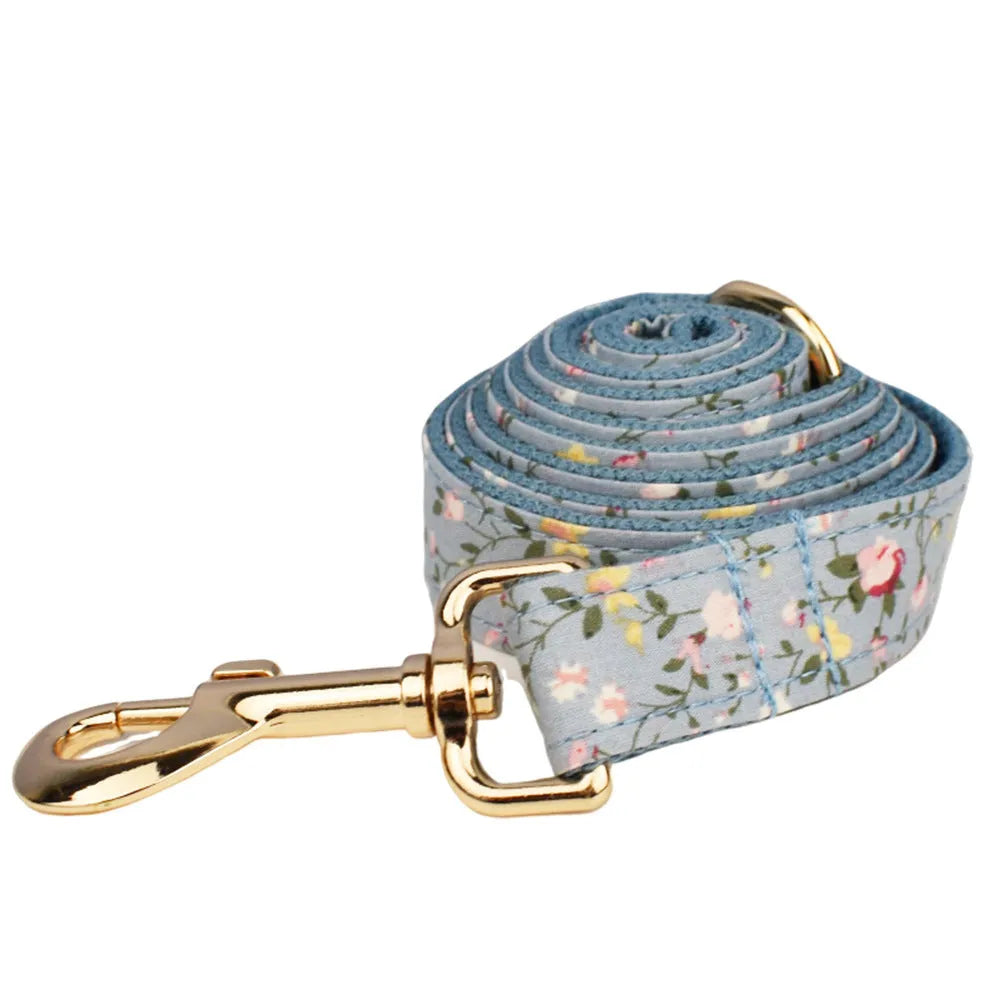 Blue floral polyester cotton dog collar set with matching leash, vest, bow and accessories