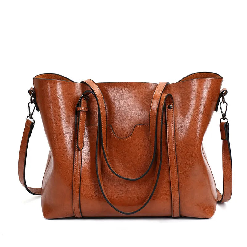 Retro style women's messenger bag in PU leather with shoulder strap, shown in light blue colour.