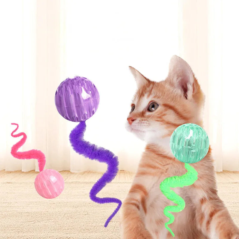 Interactive cat ball toy with worm tail attachment in green, pink, or purple colours