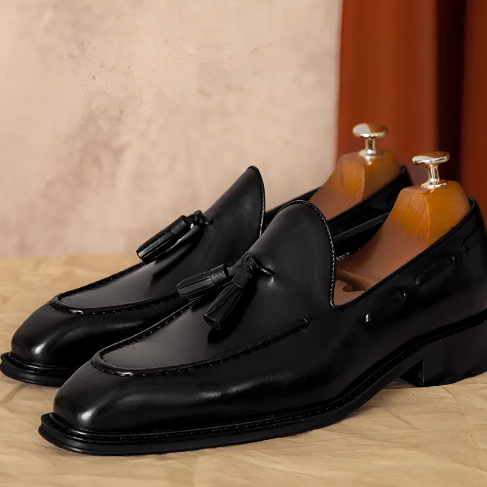 Men's black genuine leather loafers with fringed British styling and slip-on design