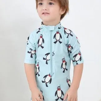 Boy's penguin print long sleeve swimsuit two-piece set with matching swimming cap