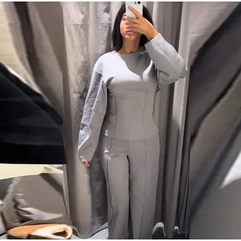 Women's polar fleece suit set showing O-neck pleated top and wide leg trousers in coordinating colours