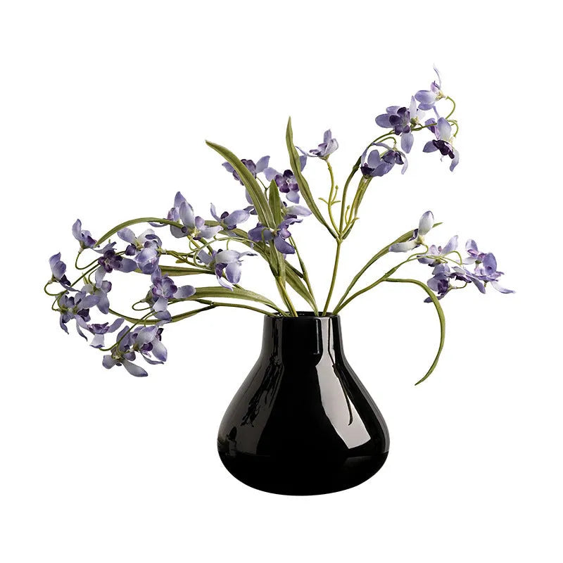 Ceramic decorative vase with artificial flowers in black or white modern design