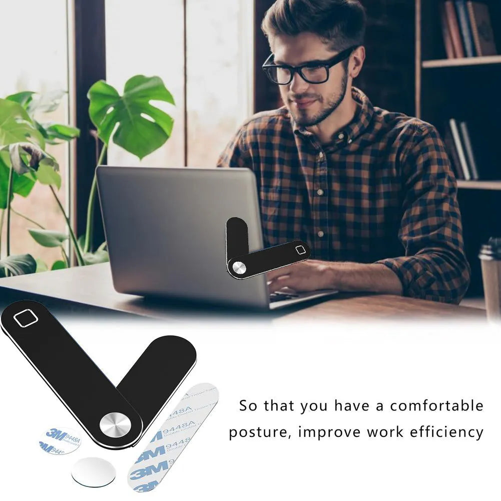 Black aluminium laptop phone holder with magnetic mount attached to computer monitor side