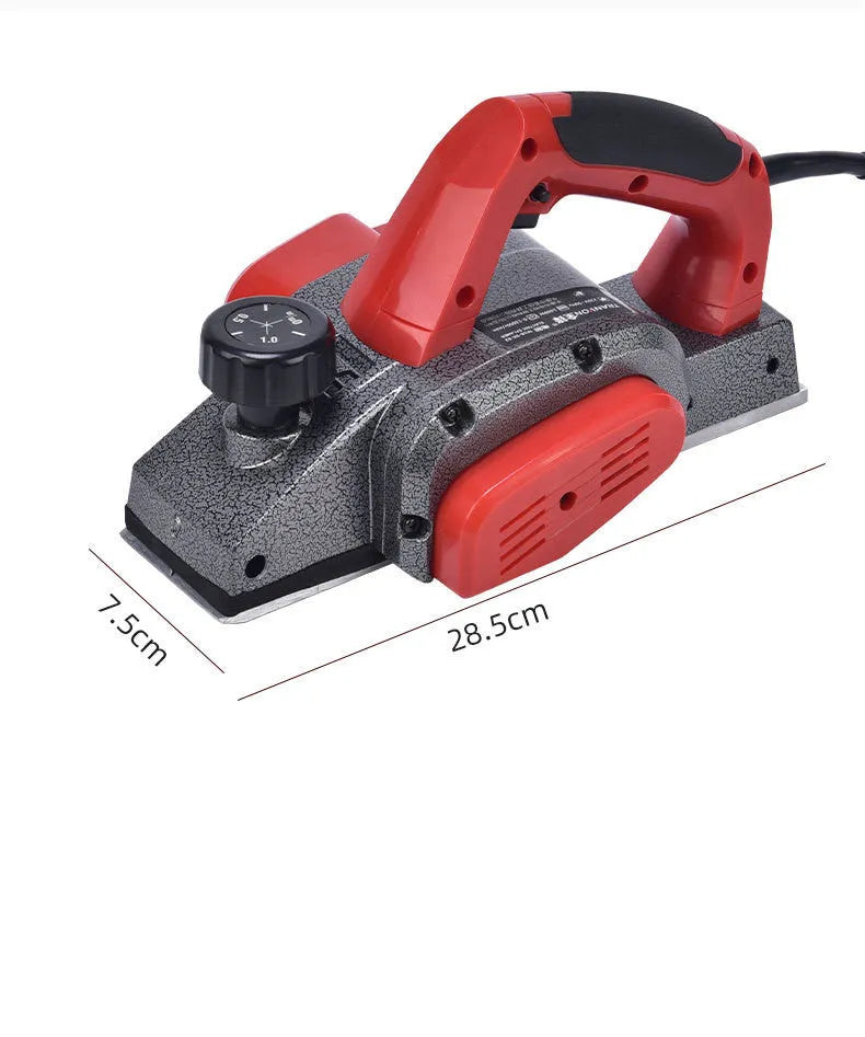 Red desktop electric wood planer with aluminium housing showing 82mm planing width
