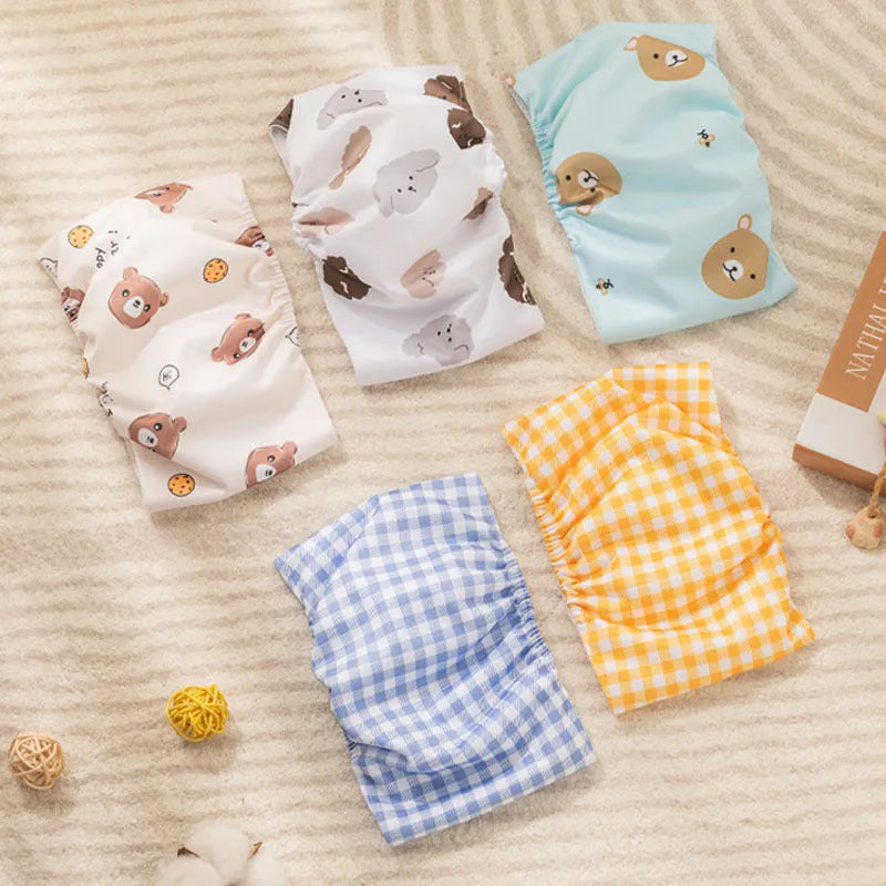 Reusable male dog diaper belly band with cartoon paw print design and elastic waistband
