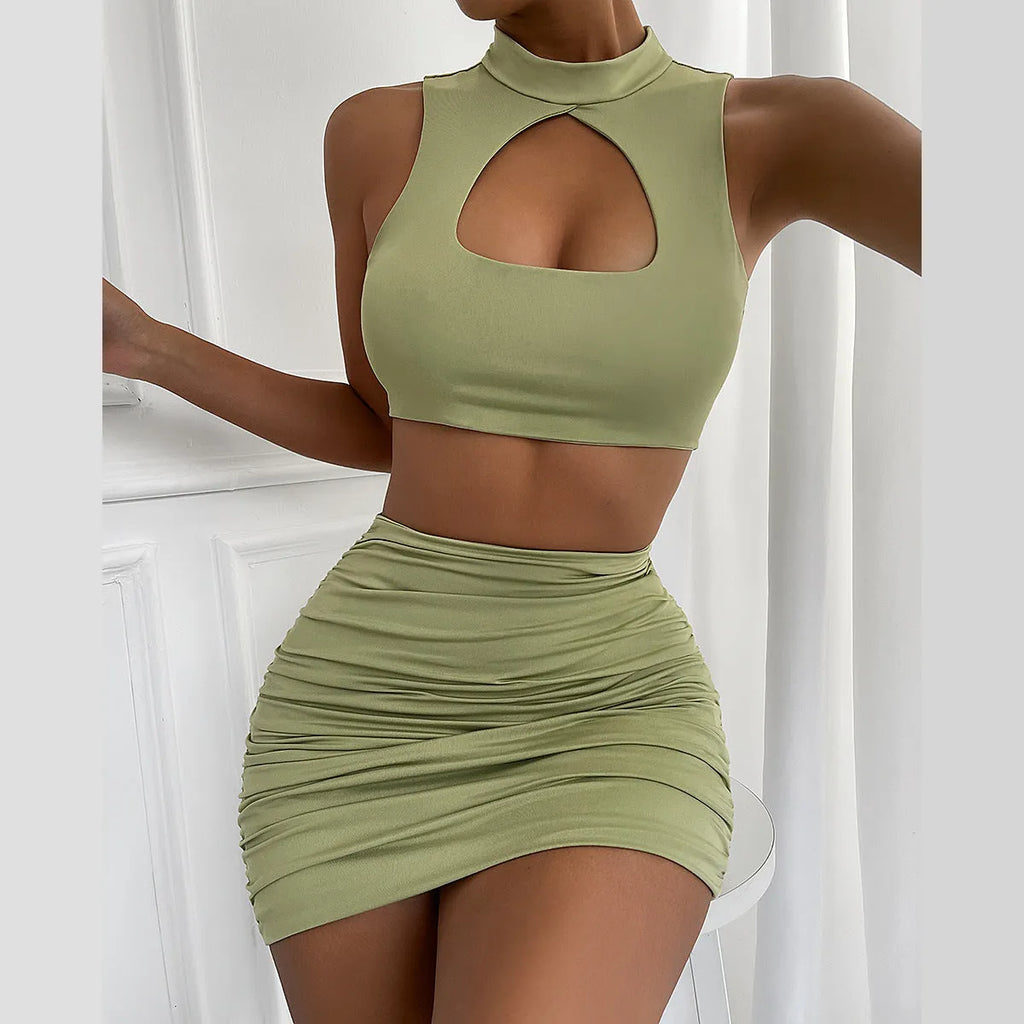 Light purple women's two-piece set with cutout vest and split hip skirt on a model.