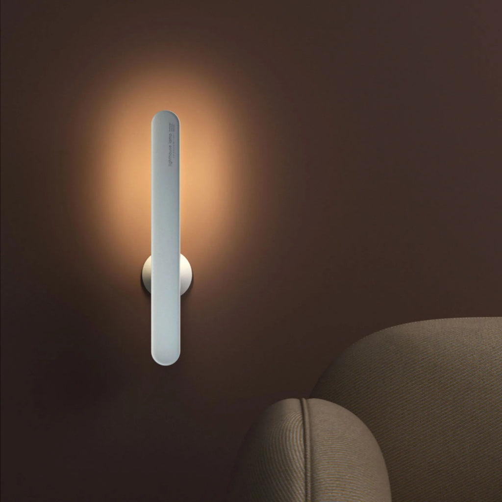 Geometric wireless table lamp with magnetic suction on metal surface showing USB connection