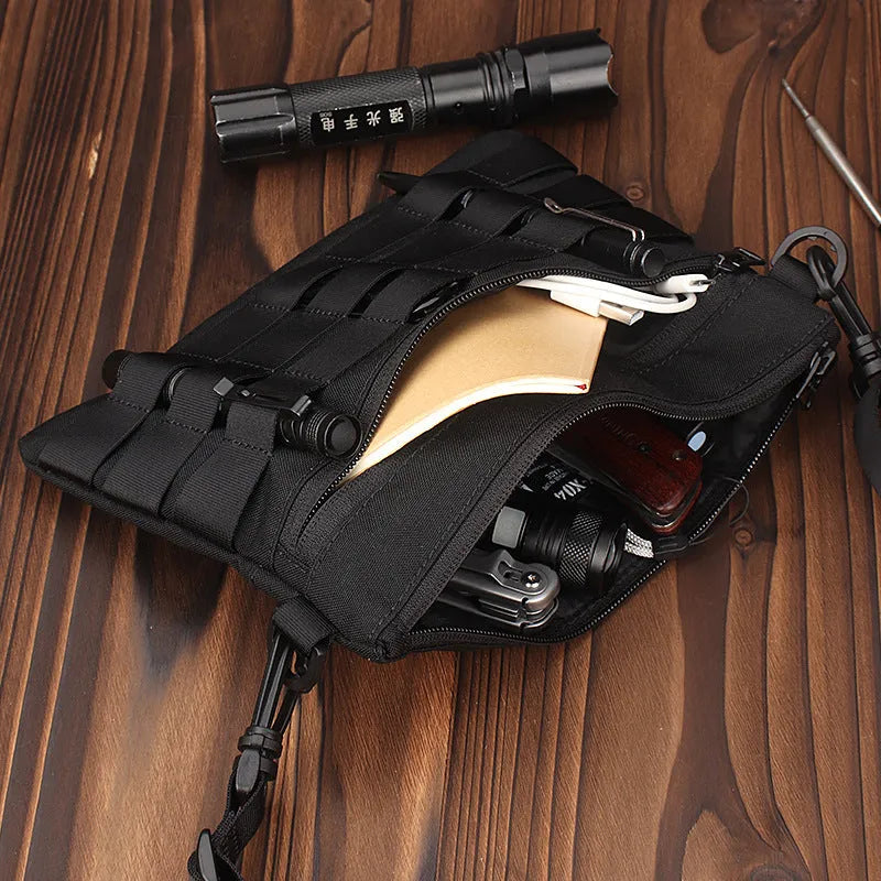 Black Oxford cloth portable outdoor kit measuring 18 by 3.5 centimetres