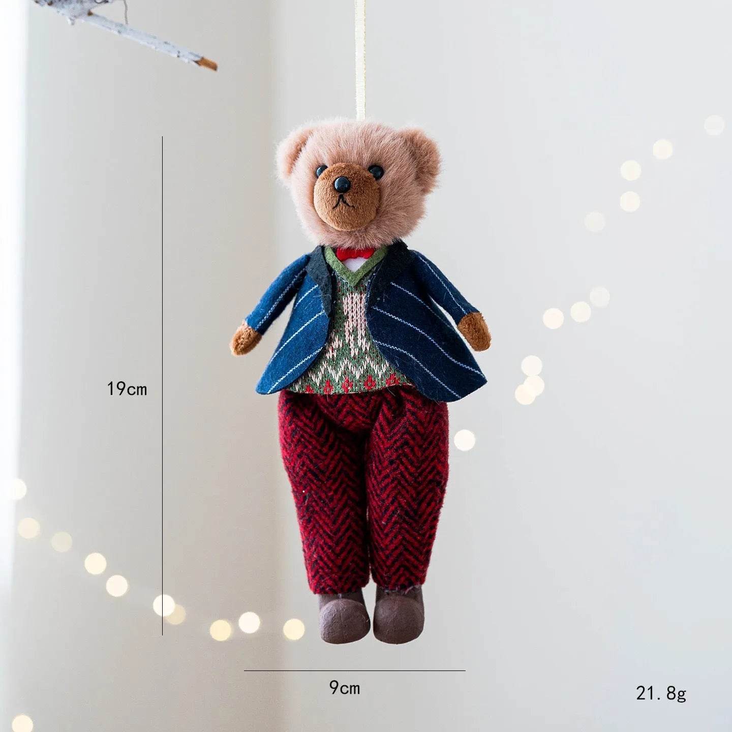 Pair of plush bear dolls wearing red and black plaid cotton clothing, cartoon style.