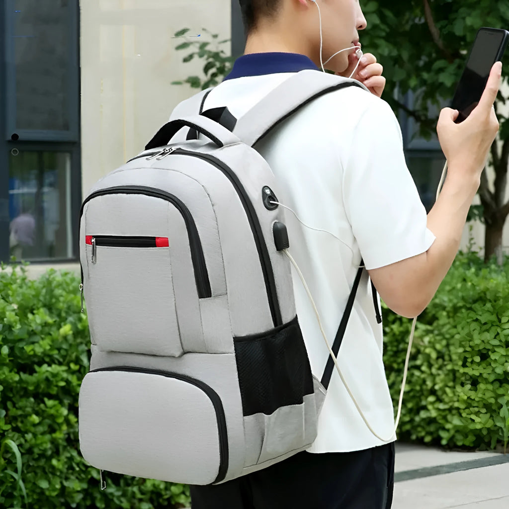 Light grey insulated Oxford cloth backpack with curved shoulder straps and pull-rod belt accessory