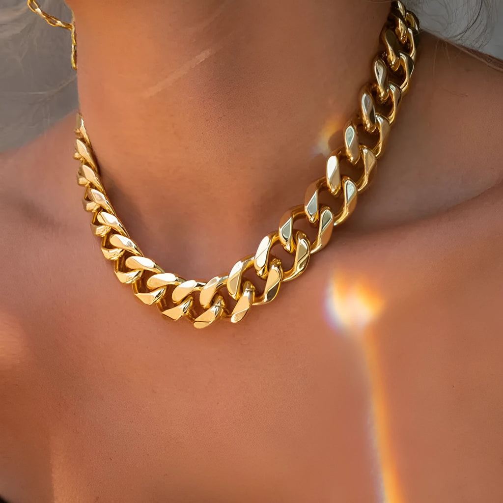 Women's gold coloured thick chain alloy necklace showing 32cm length and 6cm wide links.