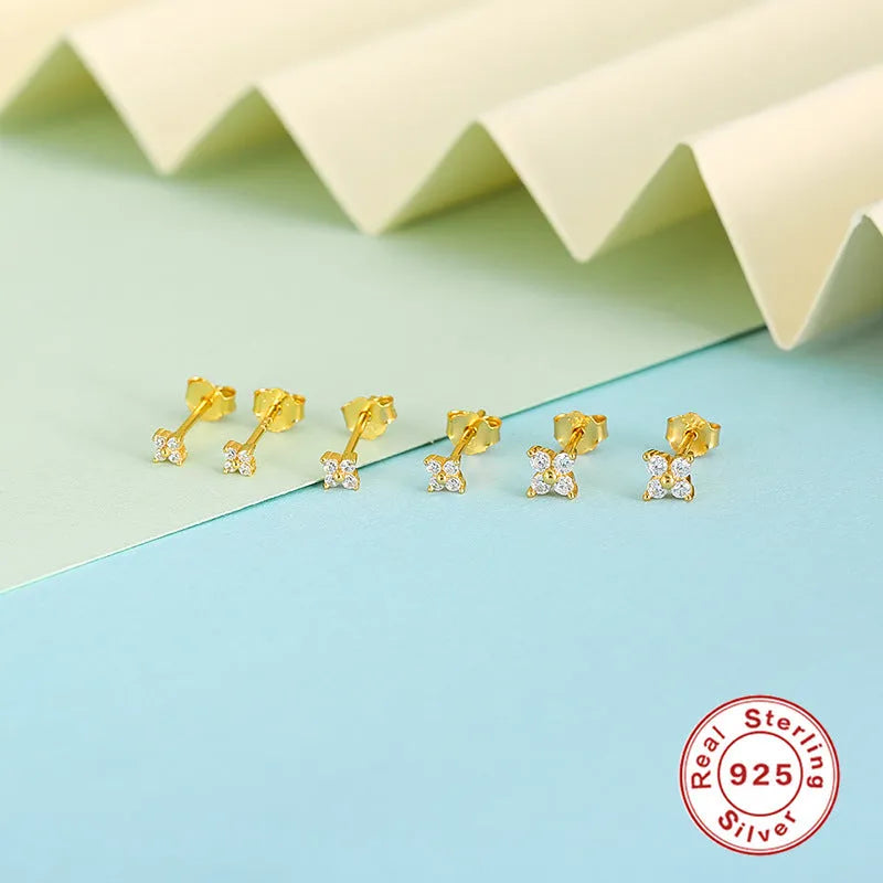 S925 sterling silver stud earrings with small petal crystal flowers in gold and platinum finishes.