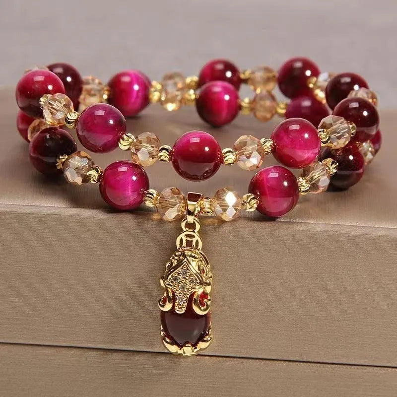 Handmade natural Vanves stone Tigereye bracelet on wrist showing single or double chain with fox motif.