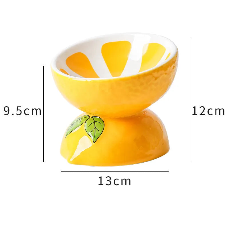 Ceramic raised cat bowl with tilted design in orange pattern, showing elevated feeding position