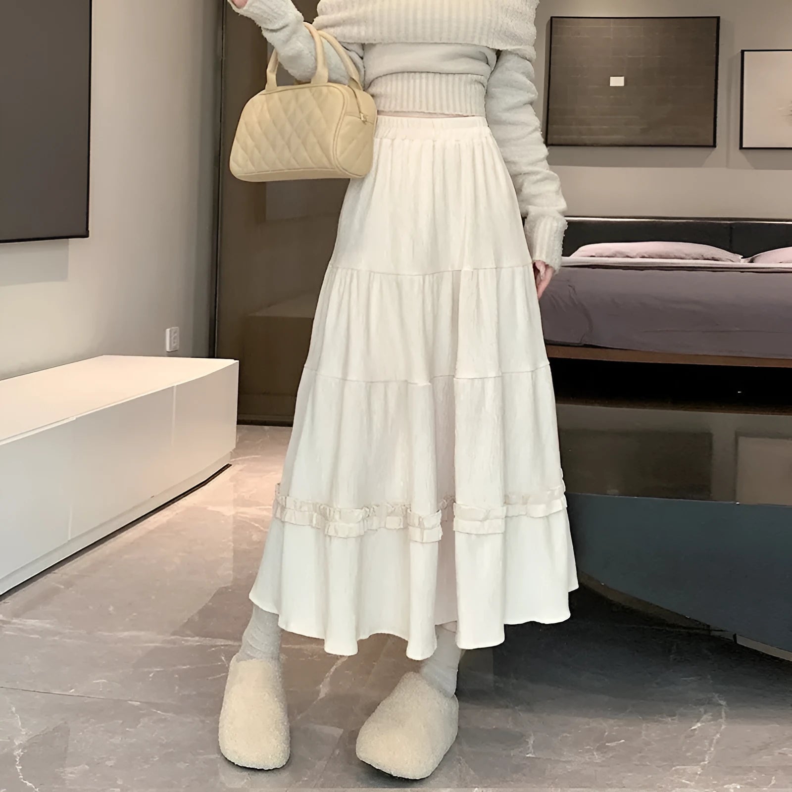 Women's corduroy A-line midi skirt with elastic waistband in milky white, black, and brown colours