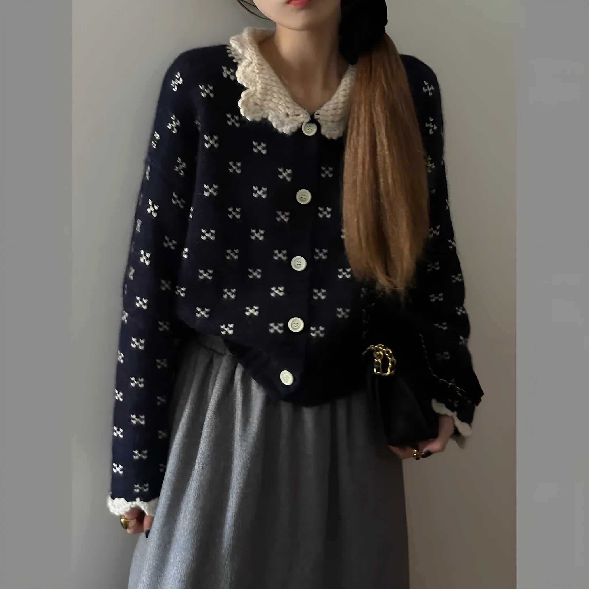 Women's floral knit cardigan coat with Peter Pan collar and button front in navy blue