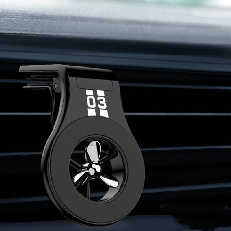 Black magnetic car air vent phone holder with adjustable rotation paddle showing phone mounting position