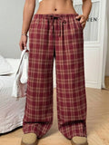 Women's plaid pattern casual trousers with drawstring waist and front pockets in blue colour option