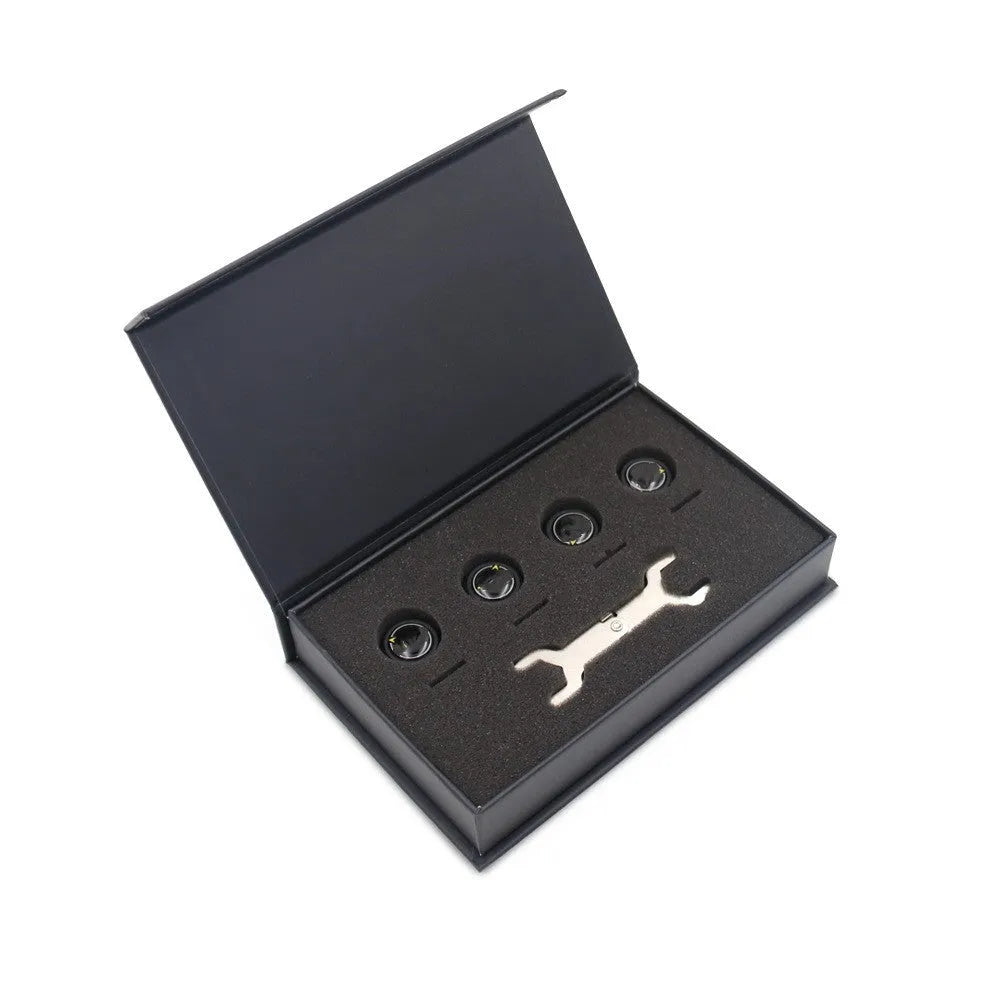 Bluetooth 5.0 automotive tire pressure monitoring system with four black external sensors, a wrench, and anti-theft screws.