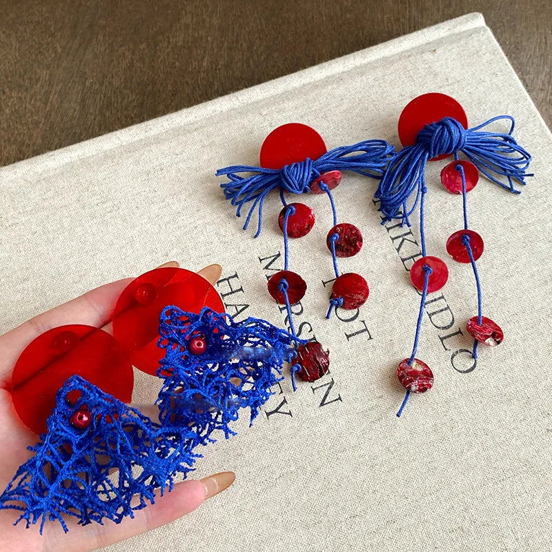 Handmade geometric blue resin flower cloth earrings for women on a silver needle base.