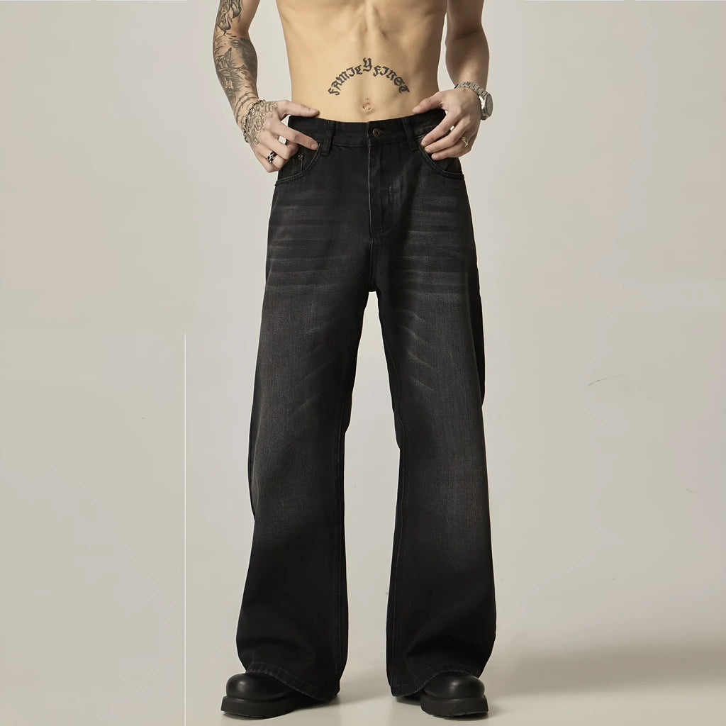 Black loose straight-leg retro jeans on a mannequin, showing zipper fly and relaxed fit.