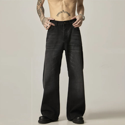 Black loose straight-leg retro jeans on a mannequin, showing zipper fly and relaxed fit.