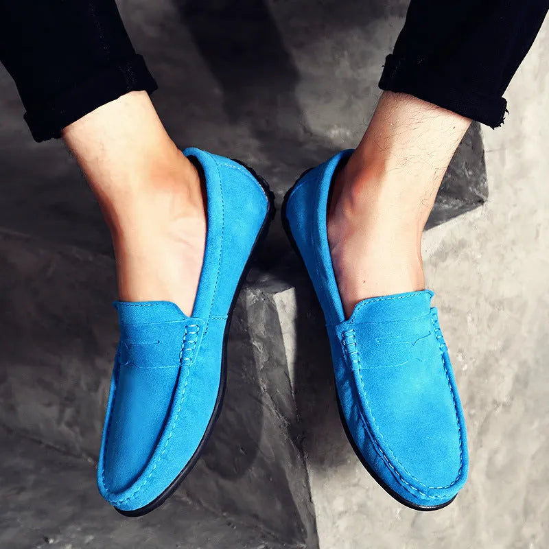 Men's brown suede casual loafers with flat rubber sole and round toe on a white background