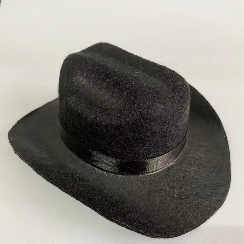 British-style brown cowboy hat for a cat with a black ribbon trim on a white background.