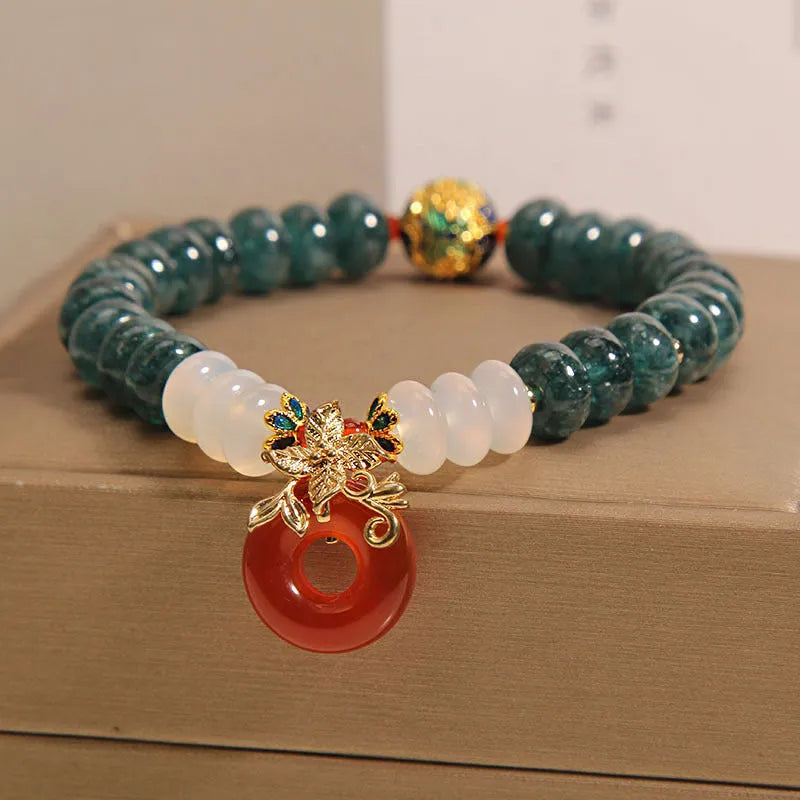 Blue water jade and red agate bracelet with peace buckle charm and rhinestone details