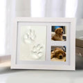 Black and white pet paw print photo frame with plaster moulding kit for DIY commemorative keepsakes
