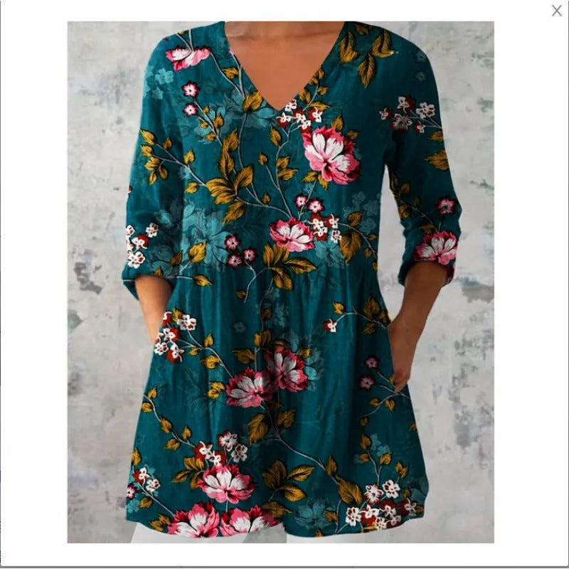 Women's printed wave pattern loose dress with wide waist and 3/4 length sleeves.