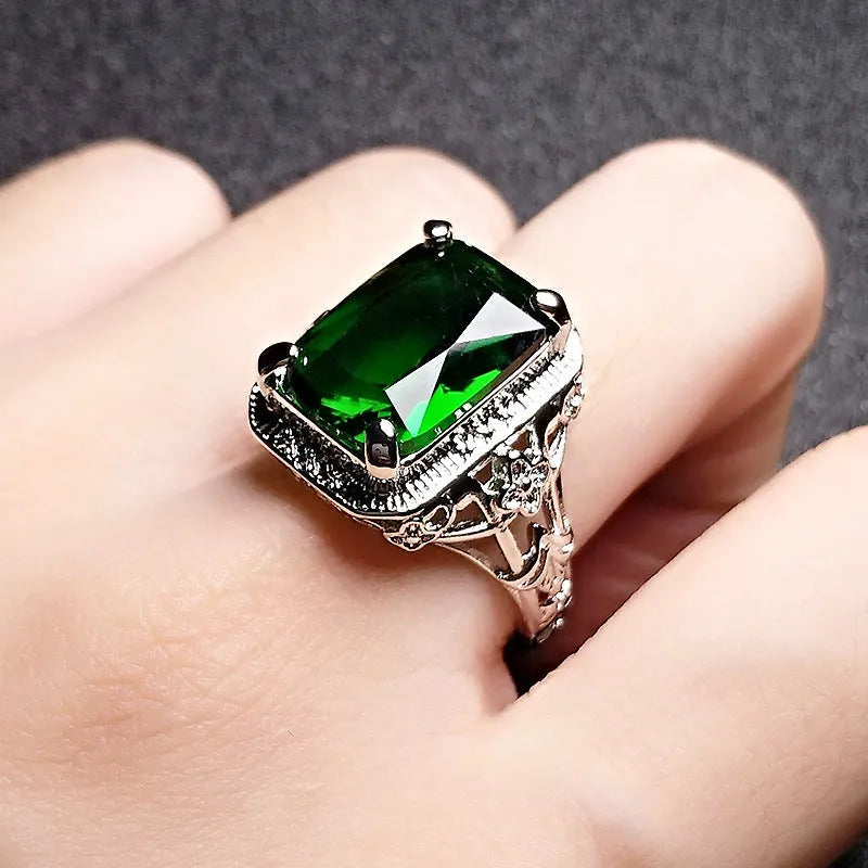 Women's adjustable geometric ring with electroplated copper construction and ruby styling
