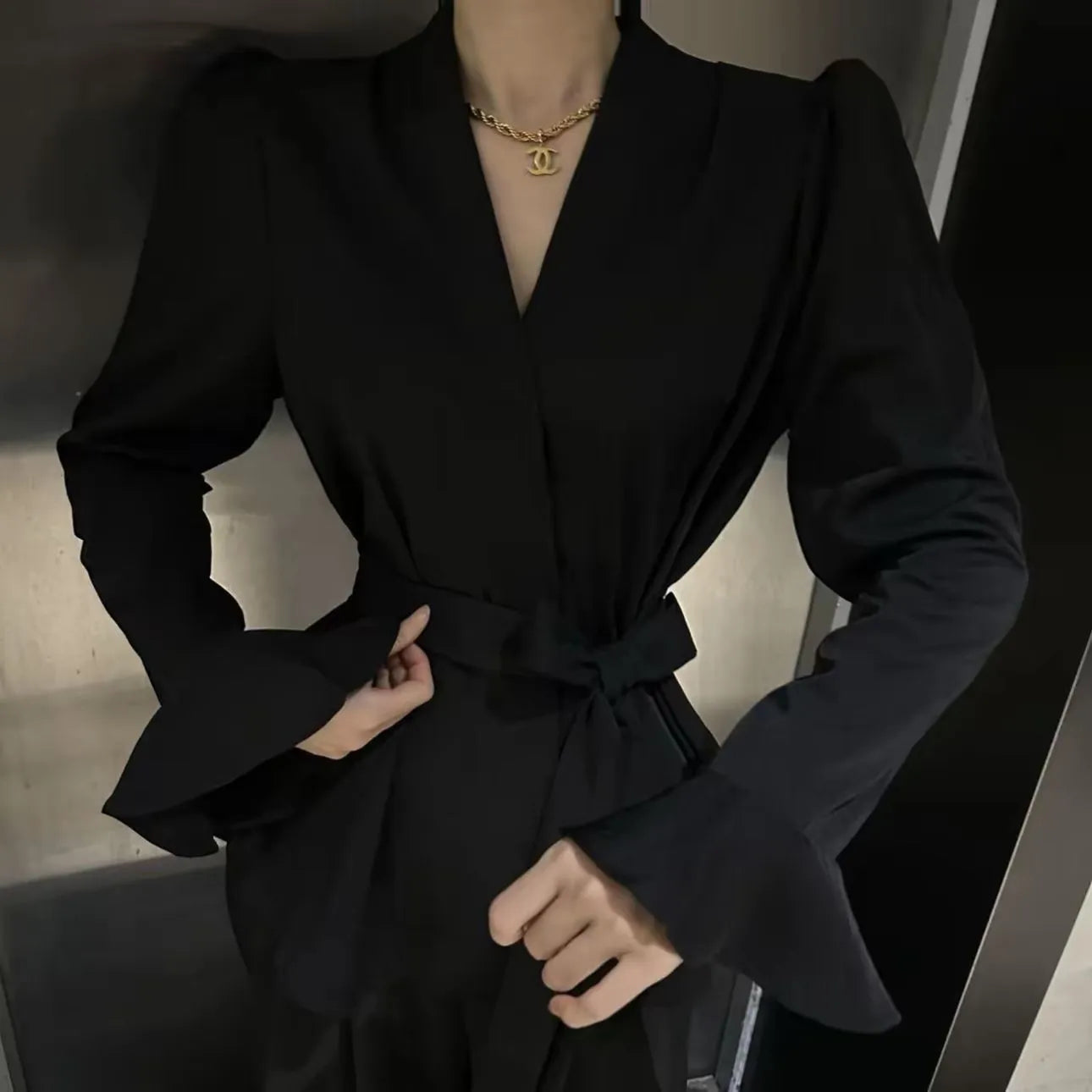 Women's French-style irregular collar tied shirt with bell sleeves in a choice of colours.