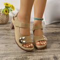 Women's light brown Velcro Roman sandals with round toe and adjustable strap on a rubber sole.