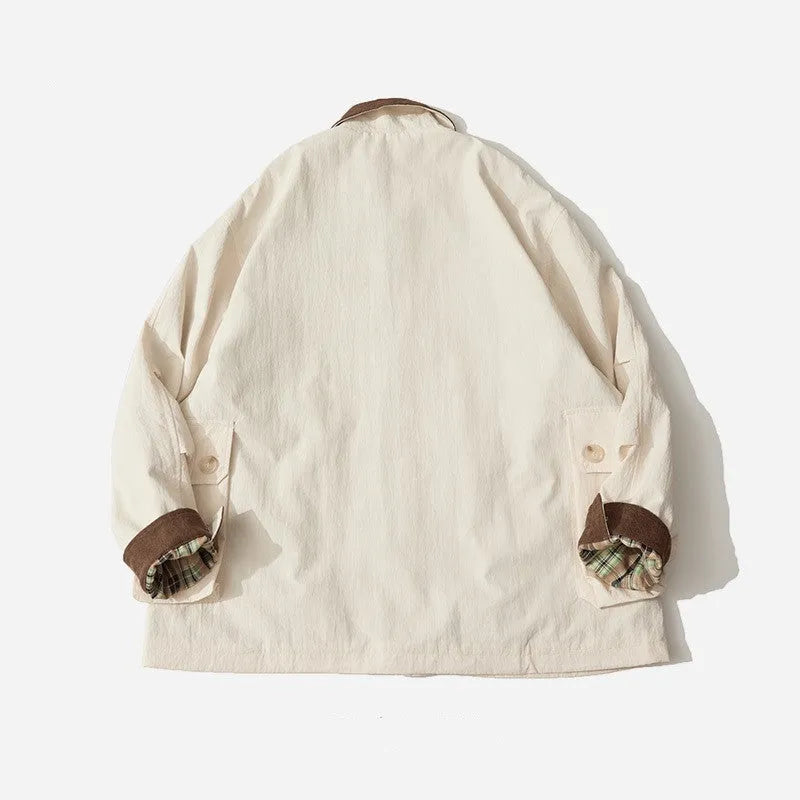 Green casual polyester jacket for men and women with side seam pockets on a hanger