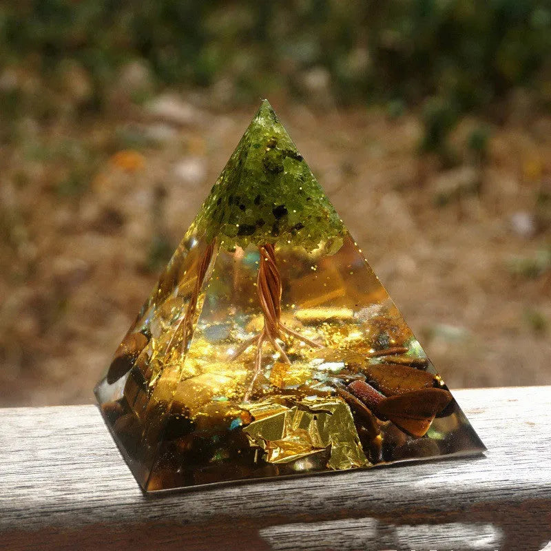 Clear resin pyramid ornament with embedded crystal gravel pieces, 6cm tall with hanging cord.